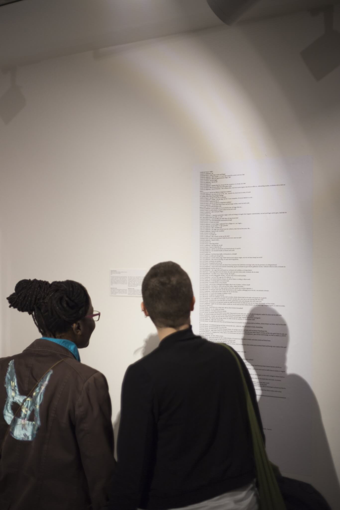 Schwules Museum visitors looking at Pascal Schaefer's artwork in the sex worker exhibition Objects of Desire